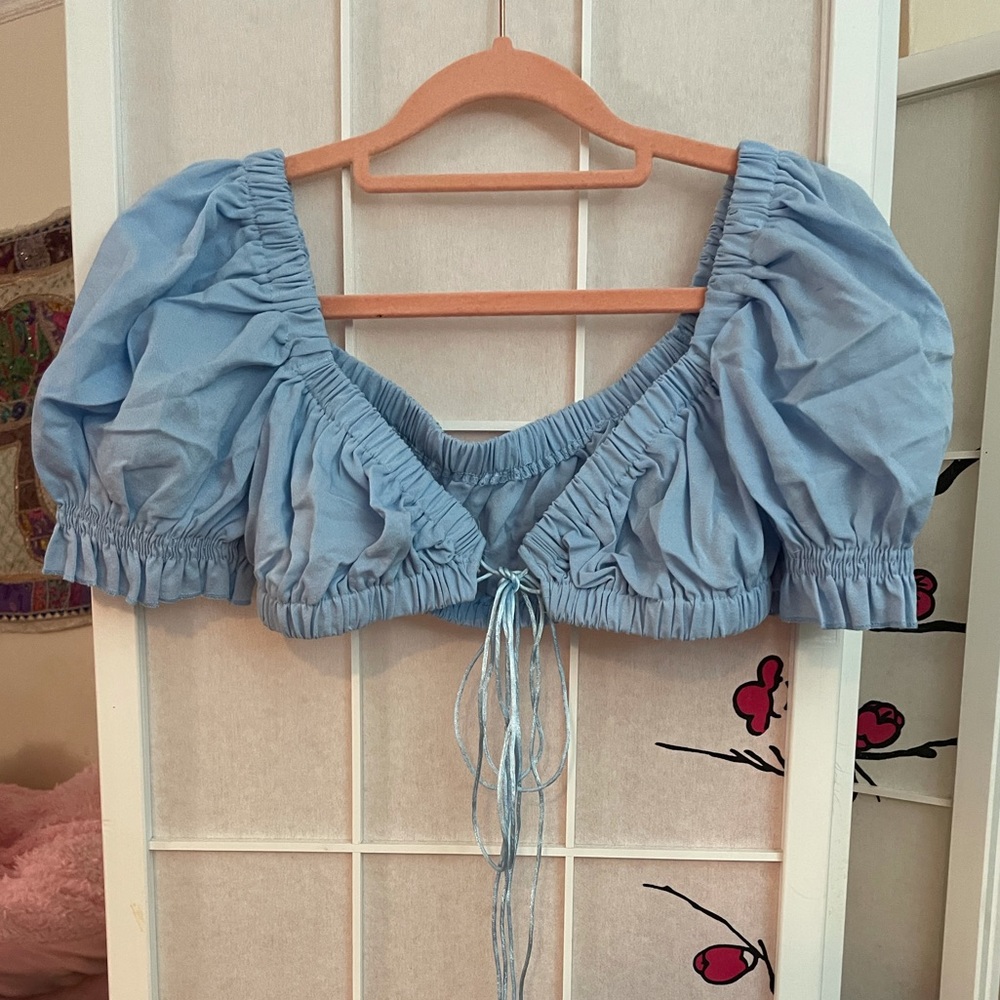 Shop Israella Boutique Blue Scrunchy Front Tie top